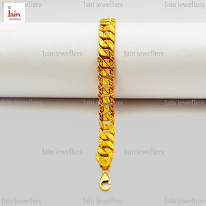 May include: A gold chain bracelet with a textured design. The bracelet has a clasp closure.
