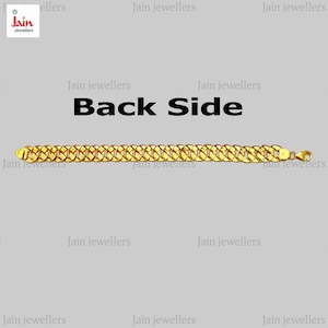 May include: A gold chain bracelet with a thick, textured design. The bracelet is shown from the back side and has a clasp.