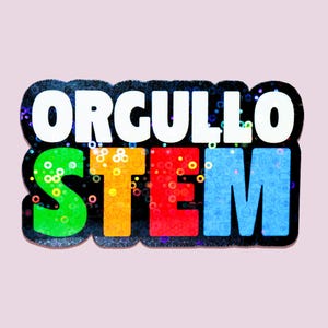May include: A colorful sticker with the words "ORGULLO STEM" in white and multi-colored letters. The letters are outlined in black and have a glittery effect. The background is a light pink.