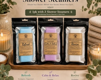 May include: Three rectangular shower steamers in individual black pouches. The blue steamer is labeled Refresh, the purple is labeled Calm & Relax, and the white is labeled Revive. Each label includes the text Serenity Bath & Body Care and 3 oz.