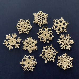 Miniature hand crocheted snowflakes. Set of 10