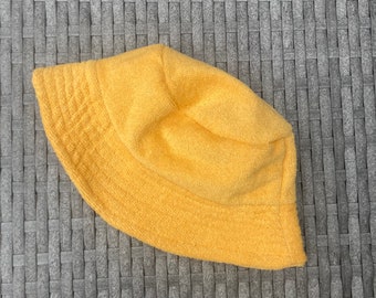 Bright yellow towelling bucket hat