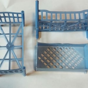 May include: A set of three ceramic mugs with a speckled, matte finish. The mugs are in shades of cream, light brown, and dark brown. Each mug has a simple, minimalist design and a rounded handle.