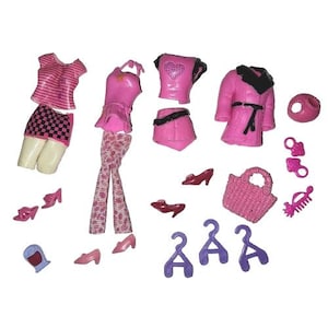 May include: A collection of pink doll clothing and accessories, including tops, pants, skirts, a coat, shoes, a purse, and hangers. The clothing items are in various shades of pink, with some featuring patterns and embellishments.