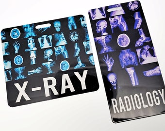 May include: Two black rectangular name tags with a hole at the top. The left tag has a blue and white X-RAY design with the text "X-RAY" in white. The right tag has a purple and white design with the text "RADIOLOGY" in white.