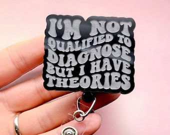 May include: Black badge holder with a white text overlay that reads "I'm not qualified to diagnose but I have theories".
