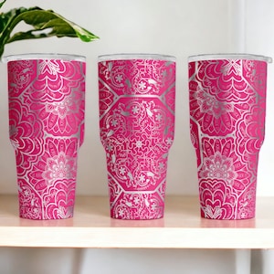 May include: Three stainless steel tumblers with a pink base and a silver mandala pattern.