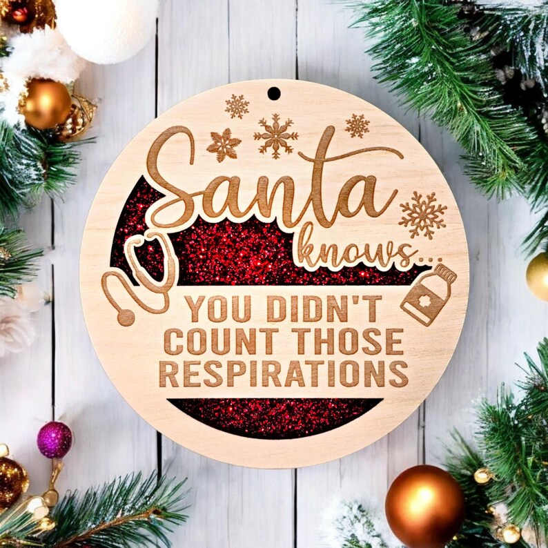May include: A wooden Christmas ornament with the text "Santa knows... You didn't count those respirations." The ornament has a red glitter center and snowflake and medical symbol designs. The ornament is round and has a hole for hanging.