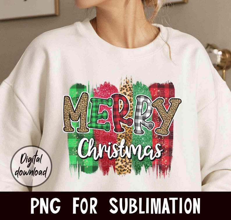 May include: White sweatshirt with a colorful "Merry Christmas" design featuring plaid, leopard print, and glitter accents.
