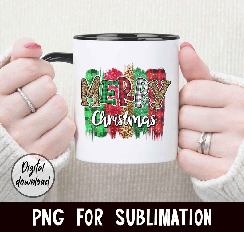 May include: White ceramic mug with a black rim and handle. The mug features a colorful design with the words "Merry Christmas" in a festive font.