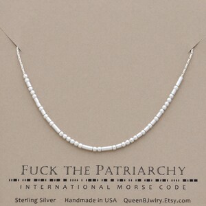 Sterling silver necklace featuring dainty beads representing 'FUCK THE PATRIARCHY' in international Morse code.  Below, the text reads 'Sterling Silver', 'Handmade in USA', and 'QueenBJwlry.Etsy.com'.