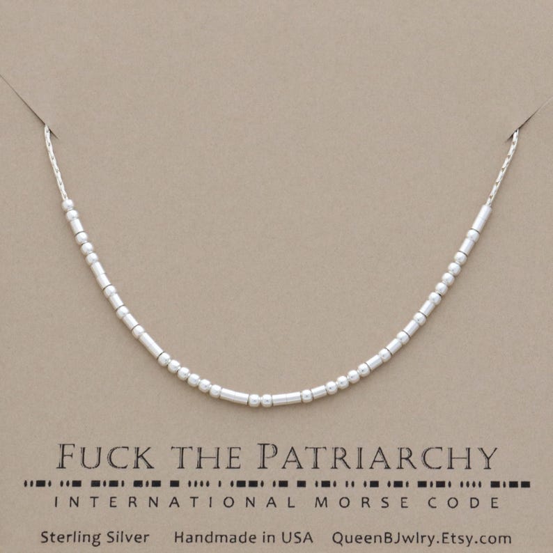 Sterling silver necklace featuring dainty beads representing 'FUCK THE PATRIARCHY' in international Morse code.  Below, the text reads 'Sterling Silver', 'Handmade in USA', and 'QueenBJwlry.Etsy.com'.