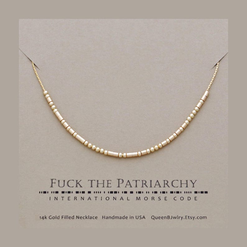 Custom morse code necklace featuring dainty beads representing 'FUCK THE PATRIARCHY' in Morse code.  Below, the text reads '14k Gold Filled Necklace', 'Handmade in USA', and 'QueenBJwlry.Etsy.com'.