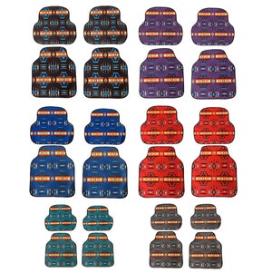 May include: Set of 12 car seat covers with a Southwestern-inspired geometric pattern in various colors, including blue, red, brown, and gray. The covers feature a repeating design with a central diamond shape and a border of smaller diamonds.