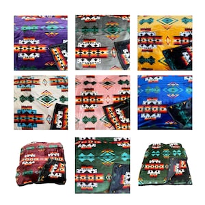 May include: A set of ten fleece blankets with a Southwestern-inspired geometric pattern. The blankets are available in a variety of colors, including purple, gray, yellow, pink, blue, red, and green.