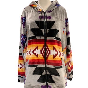 May include: Gray hooded sweatshirt with a colorful geometric pattern. The pattern features red, orange, yellow, white, purple, and blue colors.