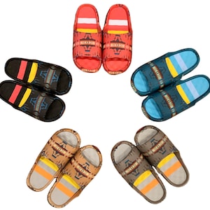 May include: Six pairs of colorful patterned slippers. The slippers are made of a soft, comfortable material and have a slip-on design. The patterns include geometric designs, stripes, and floral motifs.