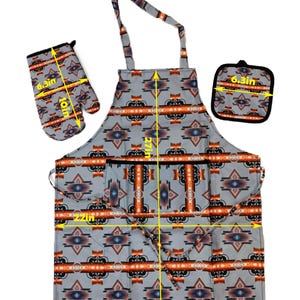 May include: A grey kitchen apron with a Southwestern-style geometric pattern in orange, blue and black. The apron has a large pocket and measures 27 inches tall and 22 inches wide. It comes with a matching oven mitt and pot holder, each measuring 6.3 inches wide and 10 inches tall.