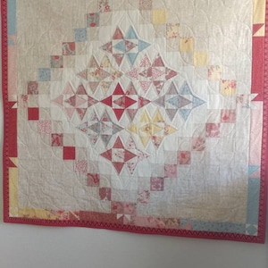 Friendship quilt 50 in by 52 in it can be use for a crib or as a wall decor