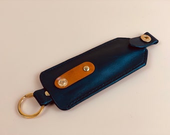 Leather key case keychain pouch holder cover with orange-brown accent and gold ring and snap