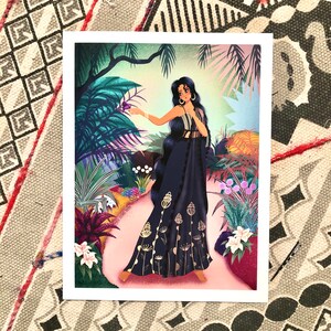 May include: A woman in a black dress with gold accents stands in a lush green jungle. She is holding a purple butterfly in her hand. The background is filled with tropical plants and flowers.