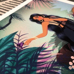 May include: A woman with long black hair reaches out to a purple butterfly in a lush green jungle setting. The woman is wearing a black and white striped top and a gold bracelet.