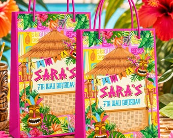 May include: Two bright pink gift bags with tropical designs. Each bag features a thatched roof, tiki mask, and the text "SARA'S 7TH LUA BIRTHDAY". The bags have pink handles and are decorated with colorful flowers and foliage.