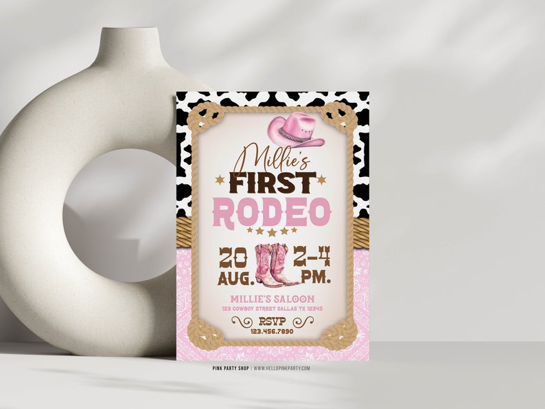 May include: Pink and brown invitation with a cowhide pattern border. The invitation says "Millie's First Rodeo" with a pink cowboy hat and boots. The date is August 20th from 2-4 PM. The location is Millie's Saloon, 123 Cowboy Street Dallas TX 12345. The RSVP number is 123.456.7890.