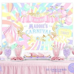 May include: A pastel-colored carnival-themed backdrop with the text "Maddie's Carnival" and "1st Big Show." The backdrop features a Ferris wheel, hot air balloons, and a circus tent. The table is set with treats and candy jars. The backdrop measures 72 inches x 48 inches.