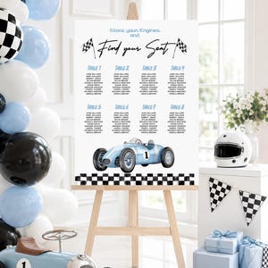 May include: A white wedding seating chart sign on a wooden easel featuring the text Start your Engines and Find your Seat, a light blue race car illustration, and a black and white checkered border, organized into eight numbered tables.