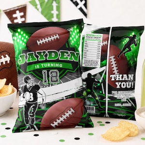 May include: Green and black football-themed party favor bags with a football graphic and the text "JAYDEN IS TURNING 12". A football, chips, and a drink are also visible. The bags say "THAN YOU!" and "LOVE JAYDEN".