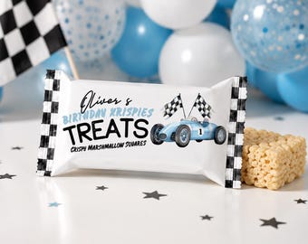 May include: A white treat bag with black and white checkered edges, featuring the text "Oliver's Birthday Krispies Treats" and a blue race car illustration. Crispy marshmallow squares are visible.