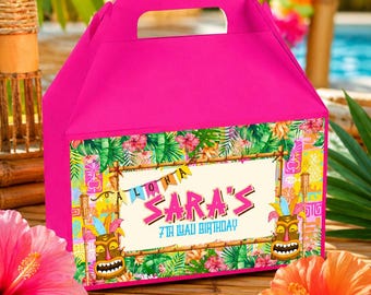 May include: A bright pink party favor box with a handle. The front of the box features a colorful tropical design with the text "Aloha Sara's 7th Luau Birthday". The design includes tiki masks, flowers, and tropical foliage.