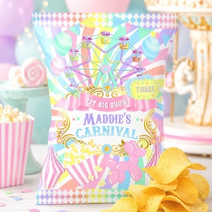 May include: A colorful carnival-themed chip bag with a Ferris wheel illustration, the text "Maddie's Carnival," and a pink balloon dog. A pile of chips sits in front of the bag. The background includes balloons and a carousel.