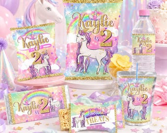 May include: A collection of party supplies with a unicorn theme. The items include chip bags, candy bar wrappers, water bottle labels, a cup, and a Rice Krispies treat wrapper. Each item features a unicorn illustration, the name "Kaylie", and the number "2". The designs have a rainbow and gold glitter accents.