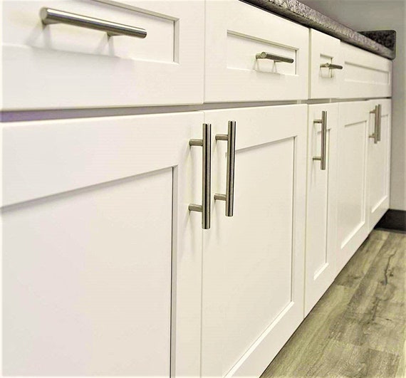White cabinets with on sale stainless steel handles