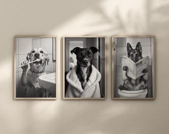 May include: Set of three framed black and white dog art prints. One print shows a dog brushing its teeth, another shows a dog in a robe, and the third shows a dog reading a newspaper while sitting on a toilet.
