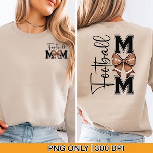 May include: Beige sweatshirt with the text "Football Mom" and a football-themed bow graphic. The front features the text "Football Mom" and the letters "M M". The back has the words "Football" and "M M" with a football bow.