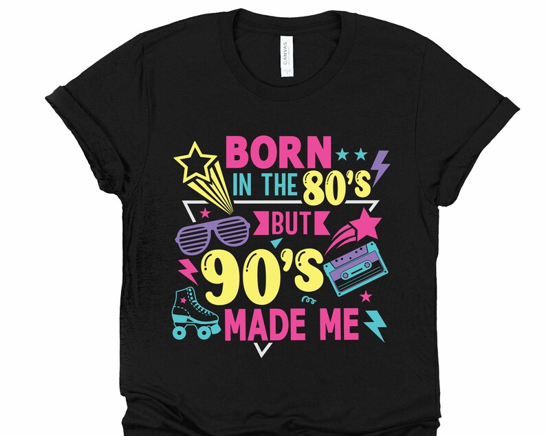 May include: Black t-shirt with a graphic design that says "Born in the 80's but the 90's made me". The graphic includes a retro cassette tape, sunglasses, and stars.