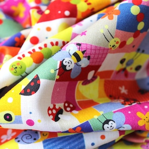 May include: A colourful fabric with a patchwork design featuring various cartoon insects, including bees, ladybirds, and caterpillars. The fabric is made of a soft, cotton blend and is perfect for quilting, crafting, and other sewing projects.