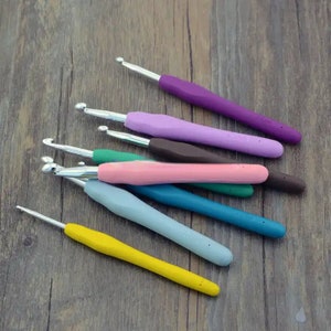 May include: A set of eight colorful crochet hooks with different sizes, ranging from 3.5mm to 8mm. The hooks are made of plastic and have a smooth, comfortable grip.