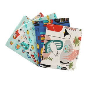 May include: A set of six fabric squares featuring a colorful cat and fish design. The squares are in shades of blue, green, and white with a variety of patterns.