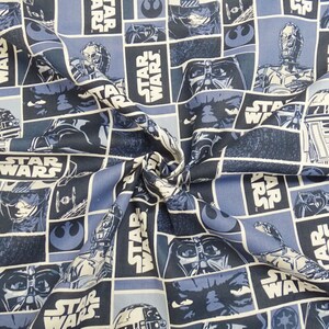 May include: Blue and white fabric with a repeating pattern of Star Wars characters and the words "Star Wars".