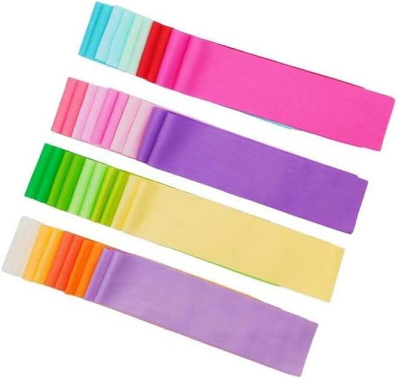 May include: Assortment of colorful ribbon rolls in various shades of blue, pink, purple, green, orange, and yellow. The ribbons are arranged in stacks and are ready to be used for crafting, decorating, or gift wrapping.