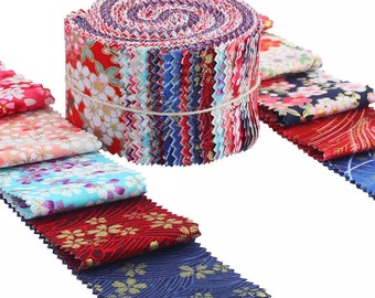 May include: A roll of colorful fabric strips with floral patterns, tied with twine. The fabric features red, white, blue, and gold floral designs. Several individual fabric pieces are fanned out, showcasing various patterns and colors.