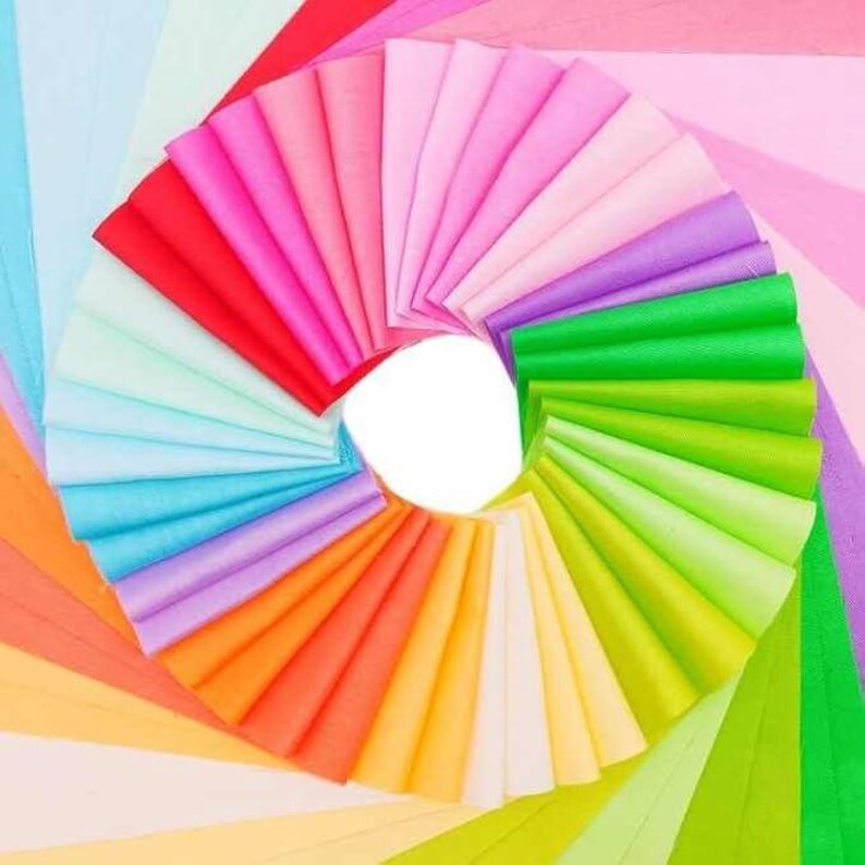 May include: A fan of colorful tissue paper in various shades of pink, blue, green, orange, and yellow. The tissue paper is arranged in a circle, with the colors radiating outwards from the center.