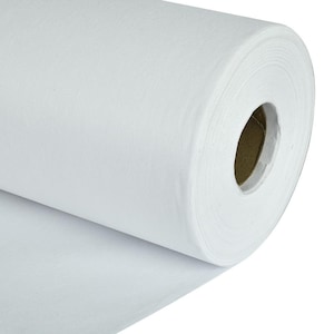 May include: A roll of white fabric, likely felt or a similar material, is displayed. The fabric is tightly rolled, revealing the inner cardboard core. The unrolled portion of the fabric extends to the left, showing its texture.