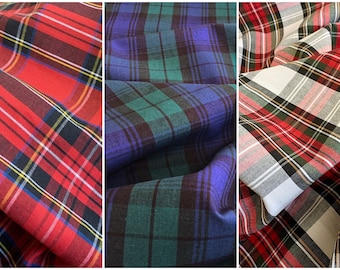 May include: Three different plaid fabrics, one red, one blue and green, and one white and red.