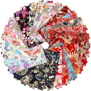 May include: A circular arrangement of numerous rectangular fabric swatches featuring diverse patterns including floral motifs, cranes, koi fish, and geometric designs in a vibrant colour palette of red, black, blue, pink, white, and gold accents.