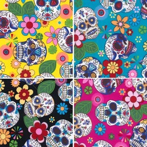 May include: A colourful pattern featuring sugar skull designs with floral accents. The image shows four colour variations: yellow, teal, black, and pink. Each panel displays the skulls and flowers in a repeating pattern.